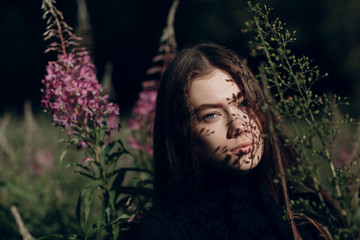 Beautiful young lady in flower field