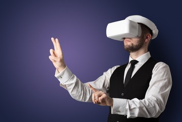 Businessman with white vr glasses in an empty room with no wallpaper
