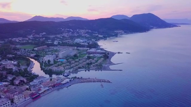 Greece, Corfu Island, drone footage of a beautiful sunset over Messonghi Beach. Camera Rise.