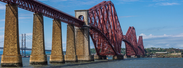 Queensferry, Scotland, UK - June 14, 2012: Suspension Forth Road Bridge seen through pillars of...