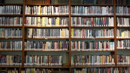 Panning shot of a library bookcase