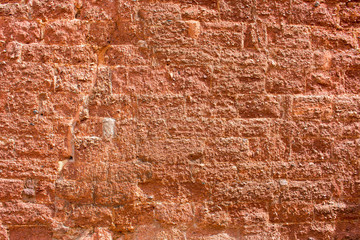 Hintergrund – alte verputzte  Natursteinmauer
