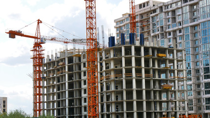 Concrete building under construction. Skyscraper construction. Construction of a high rise building.