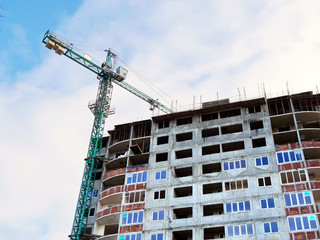 Tower crane near building. Building site. Construction site.