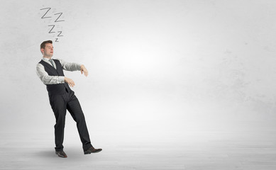 Tired businessman with sleeping sickness going somewhere
