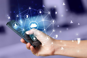 Hand using phone with centralized cloud computing system and network security concept
