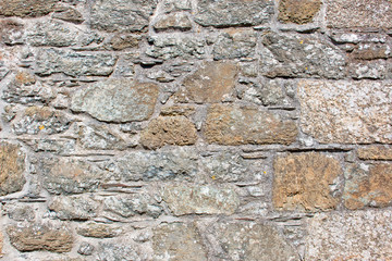 Hintergrund – Natursteinmauer mit eckigen Steinen