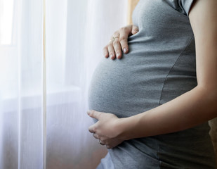 Belly of a pregnant woman at 9 month old.