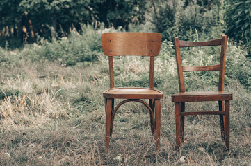 Wooden chair, wooden chair twin, Pair old wooden chair outdoors. Around the lush grass, The...