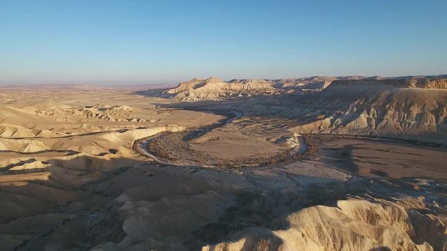 Aerial footage at Sde Boker, in Neguev desert of Israel. Dry river in the desert landscape.