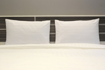 white pillows on the bed in bedroom