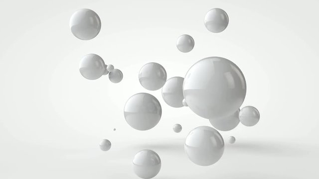 3D animation of many white balls moving in space.