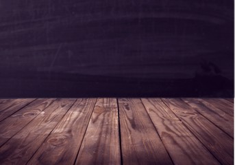 Wooden desk on dark background