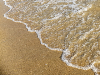 The beach sand and wave sea background
