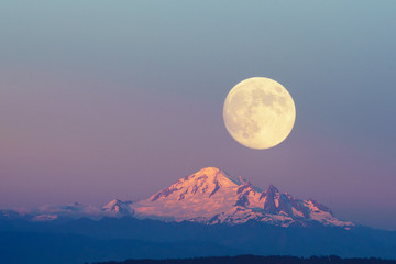 Mountain Baker and full moon with sunset sky backgrounds