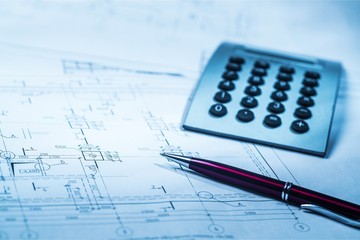 Calculator, pan and the financial report. Close up