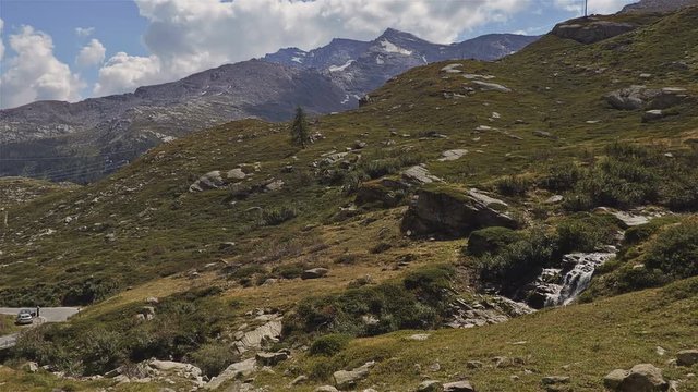 cars climbing the mountain in the Gran Paradiso National Park - Time lapse. Turin, Italy