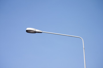 Lighting electronic on the road under blue clear sky.