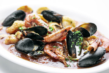 mixed fresh seafood stew with prawns mussels scallops and clams