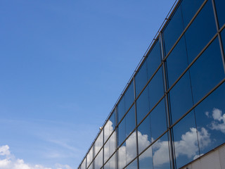 Fototapeta na wymiar Cloud in Glass Building reflection