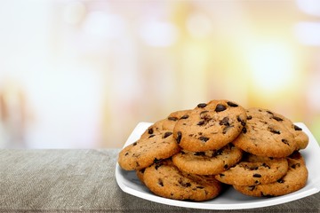 Plate of chocolate chip cookies isolated on white background