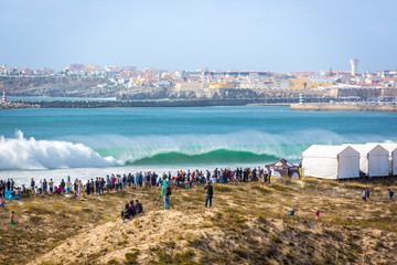 Peniche, Portugal - Oct 18th 2017 - Big crowd of people watching a big wave breaking at the 2017...
