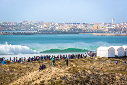 Peniche, Portugal - Oct 18th 2017 - Big crowd of people watching a big wave breaking at the 2017 MEO Rip Curl Pro Portugal in Peniche, coast of Portugal.