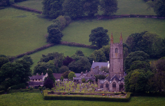 Timeless and Quaint English Church in a rural townsurrou ded by green fields