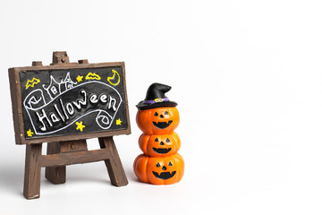 Halloween pumpkins stacked three balls and brown label with halloween text.
