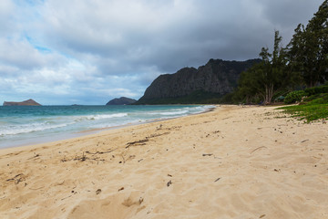 Beautiful Waimanalo beach with turquoise water and cloudy sky, Oahu coastline, Hawaii