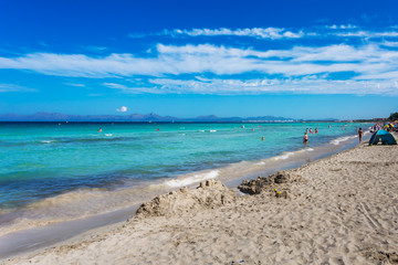 Fototapeta na wymiar Beautiful summer beach with turquoise water in Alcudia, Mallorca