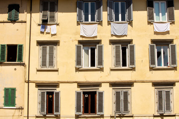 Obraz premium Apartment building with shuttered windows