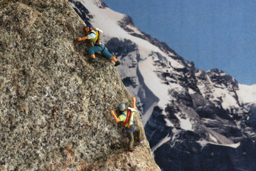 Men on mountain mountaineering and mountain hiking up in the mountains with blue skies and good...