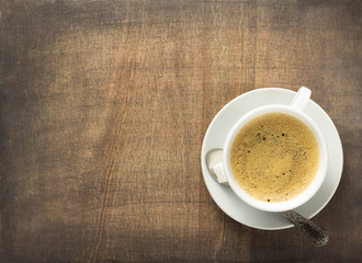 cup of coffee on wooden background