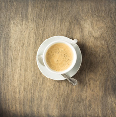 cup of coffee on wooden background