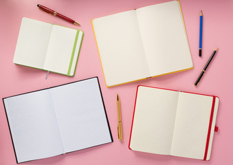 notebook and pen at abstract background