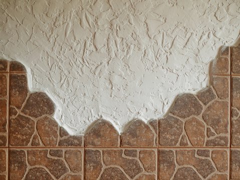 Polonne / Ukraine - 29 August 2018: white wall plaster with decorative tile