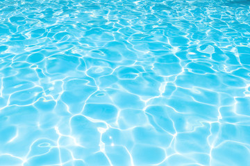Fototapeta na wymiar Wonderful blue and bright ripple water and surface in swimming pool, Beautiful motion gentle wave in pool for blue abstract or nature background