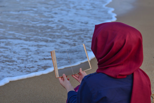 girl reading book and creative concept at the seaside