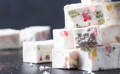 Sweet zephyr with marmalade, dark table, selective focus