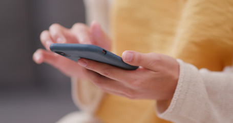 Woman use of mobile phone at home