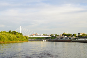 The suspension bridge and Tura River Embankment in Tyumen, Russia.