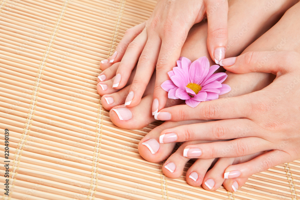 Wall mural care for beautiful woman skin and nails. pedicure and manicure at beauty salon. woman legs, hands wi