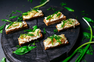 Vegetarian Bruschette with green decoration