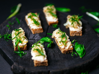 Vegetarian Bruschette with green decoration