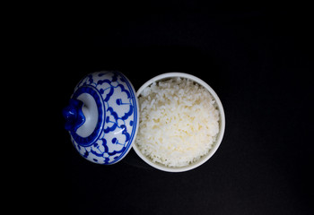 white rice (Thai Jasmine rice) in bowl isolated on Black background
