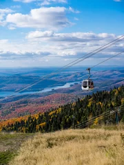 This is a picture of autumn leaves at Mont-Tremblant in the Laurentian plateau in Quebec, Canada. It is a scenery from Mont-Tremblant mountain. It is very beautiful with red and orange. © Tom Spark