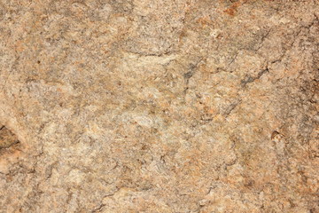 Granite background. Granite stone close up. Texture of natural material. Rocky rocks of ancient times. Natural pattern