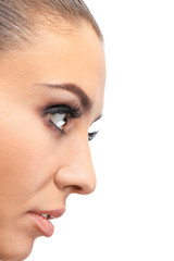 Fototapeta premium Beautiful young woman with eyelash extensions on light background, closeup