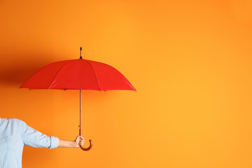 Woman holding beautiful umbrella on color background with space for design - obrazy, fototapety, plakaty